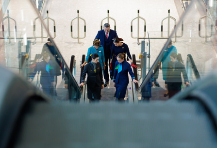 IAG staff on Heathrow escalator