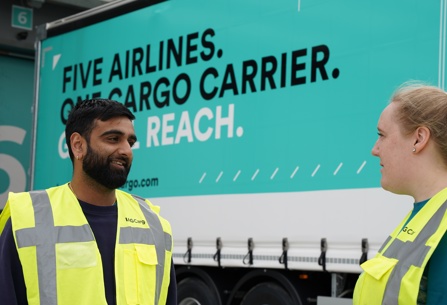 IAG Cargo staff standing near truck 2