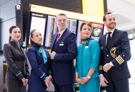 Cabin crew from IAG airlines and Iberia pilot posing at Heathrow