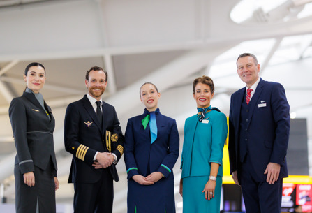 Iberia pilot and members of cabin crew from other IAG airlines posing