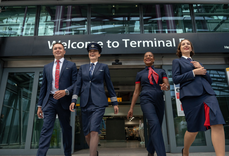 British Airways staff walking near Heathrow terminal building