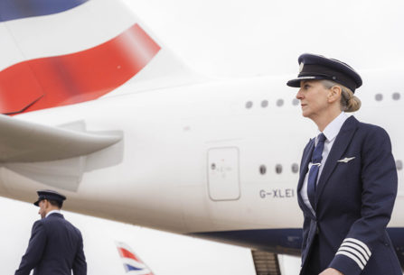 British Airways pilot standing near plane
