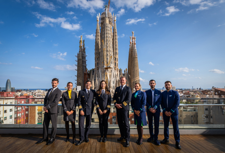 LEVEL and Vueling cabin crew and pilots posing on a Barcelona rooftop
