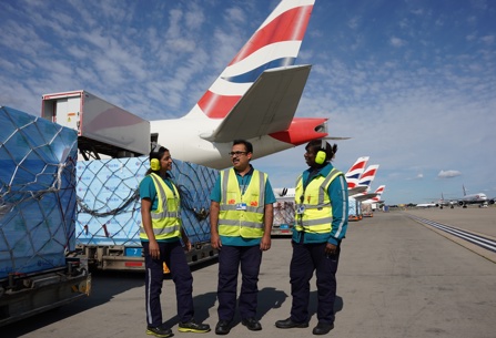 IAG Cargo staff posing near British Airways plane