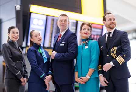 Members of IAG airlines' cabin crew and pilot posing