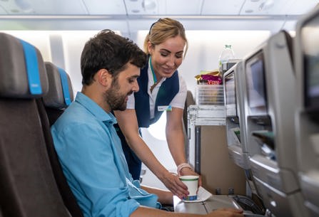 LEVEL cabin crew member serving customer